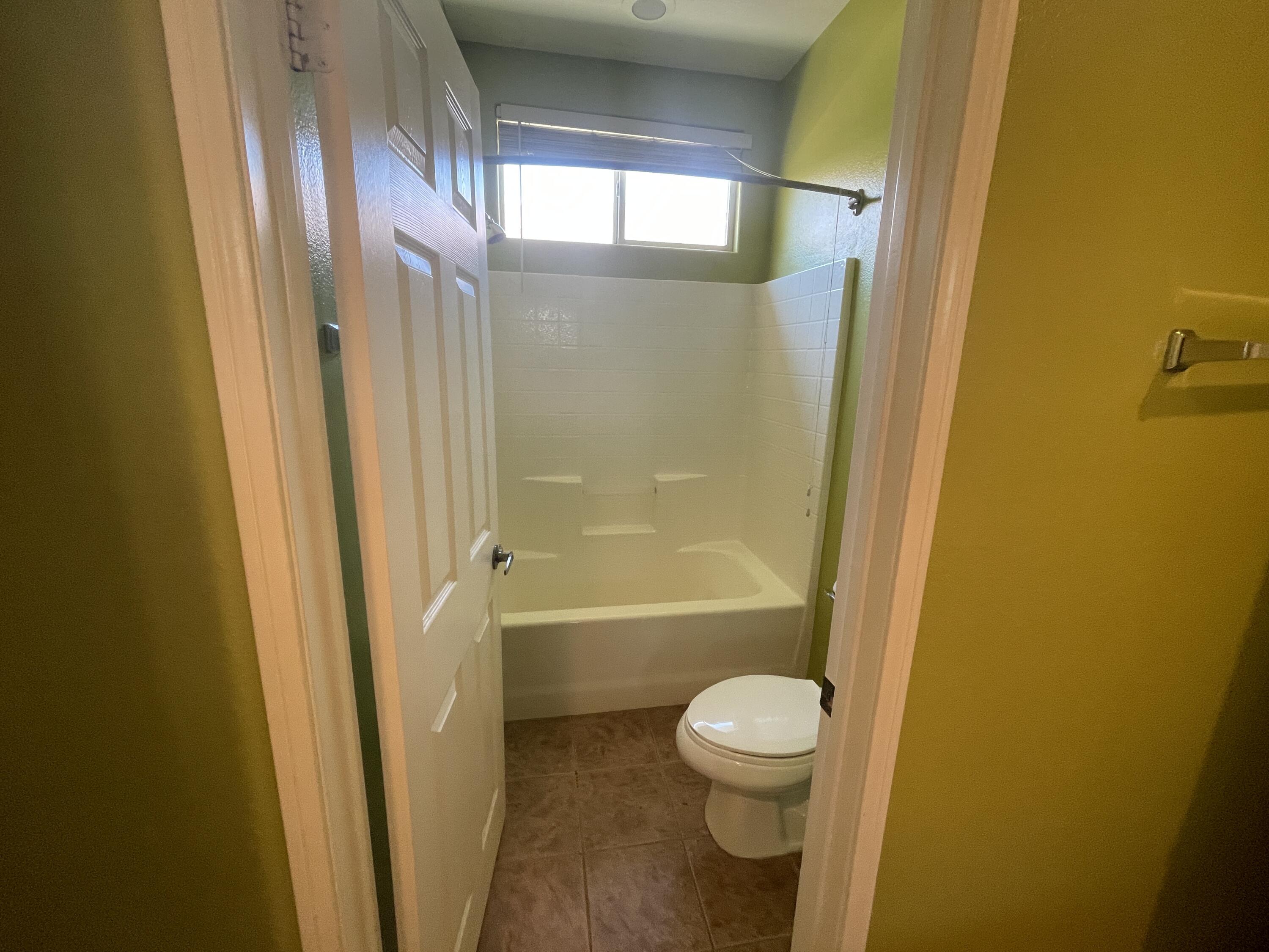 82838 Vincent Drive Indio, CA 92203 - Photo 16 of 37 a bathroom with a bathtub and a shower