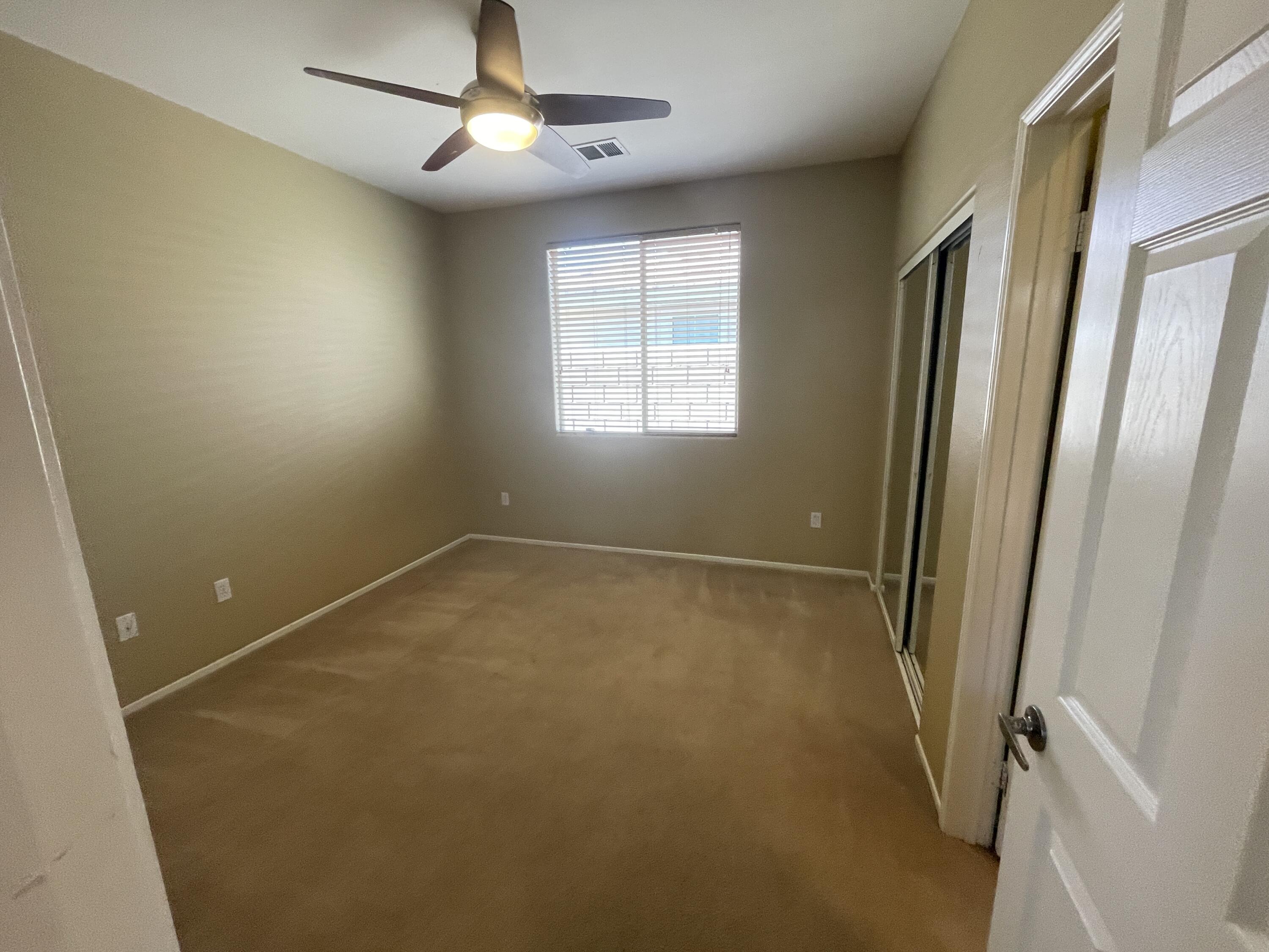 82838 Vincent Drive Indio, CA 92203 - Photo 17 of 37 a view of empty room with windows