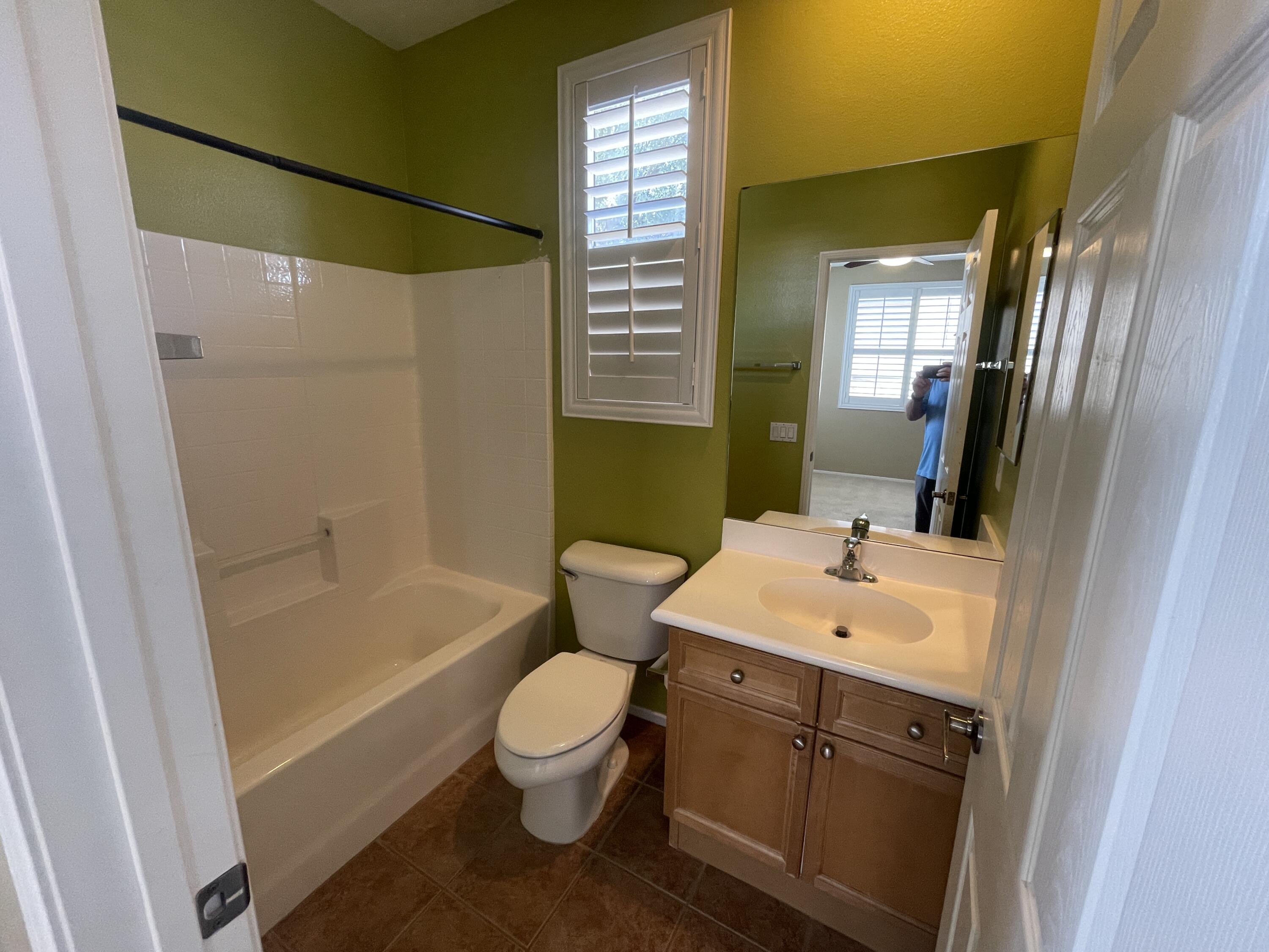 82838 Vincent Drive Indio, CA 92203 - Photo 19 of 37 a bathroom with a sink toilet and shower