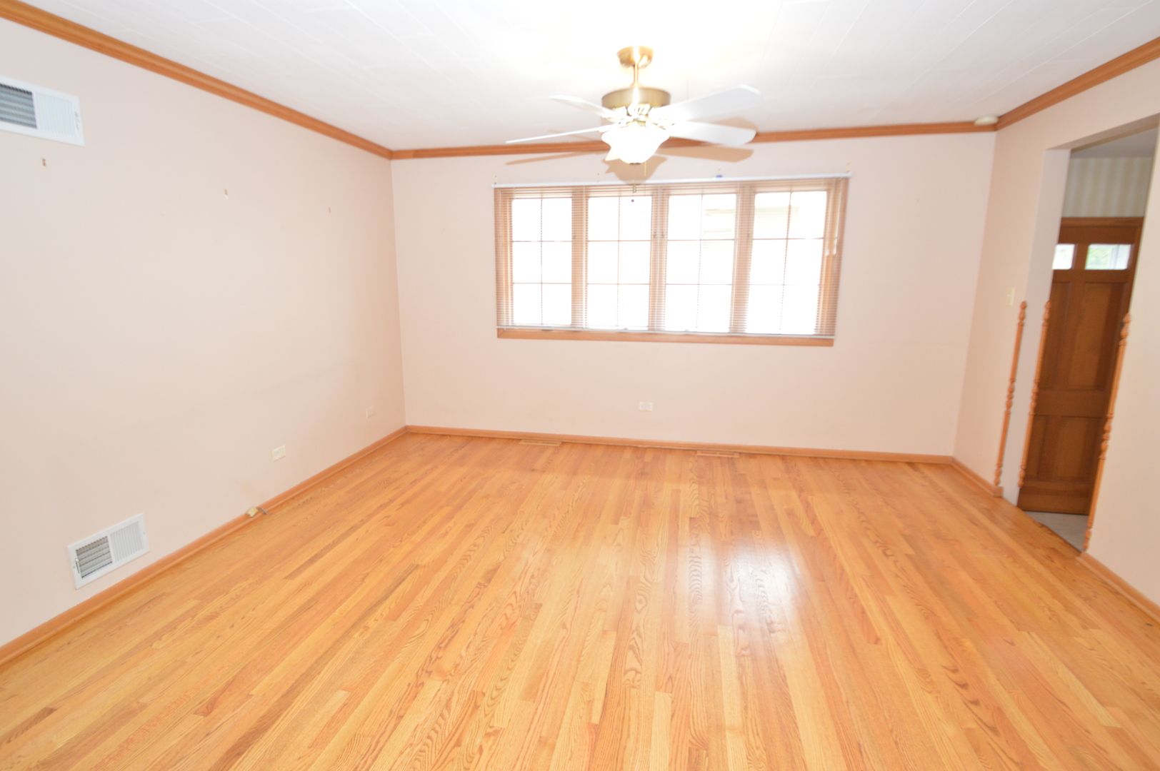 499 Selborne Road Riverside, IL 60546 - Photo 17 of 35 wooden floor in an empty room with a window