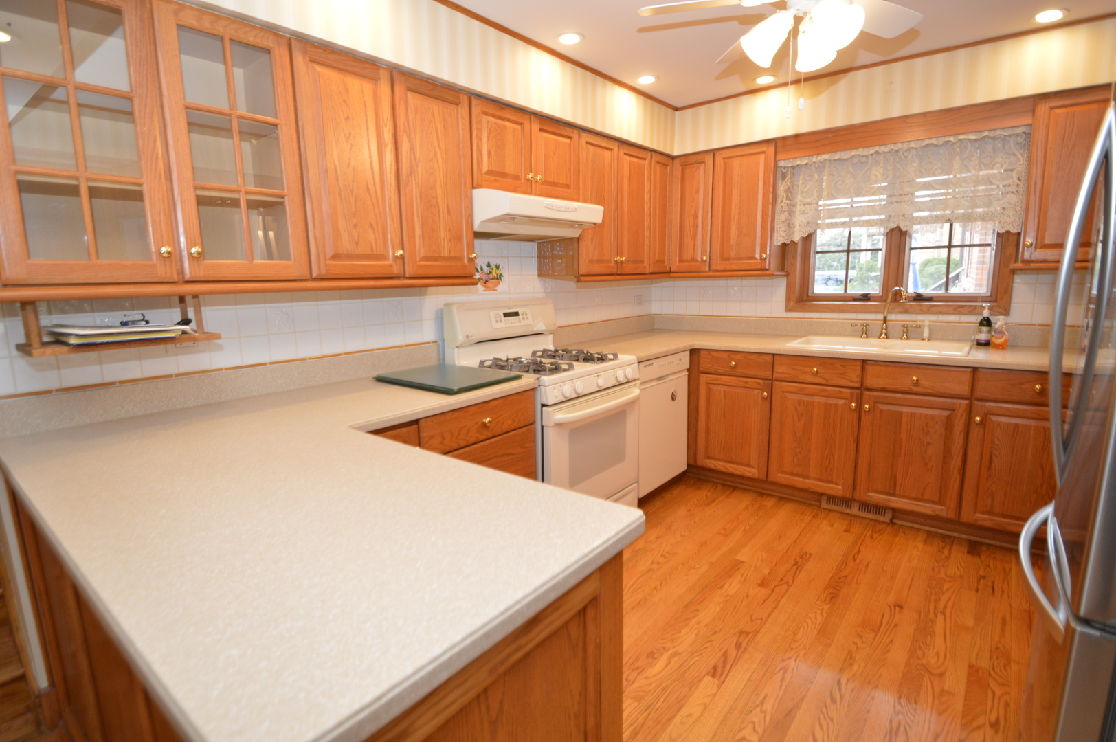 499 Selborne Road Riverside, IL 60546 - Photo 7 of 35 a kitchen with a sink and cabinets