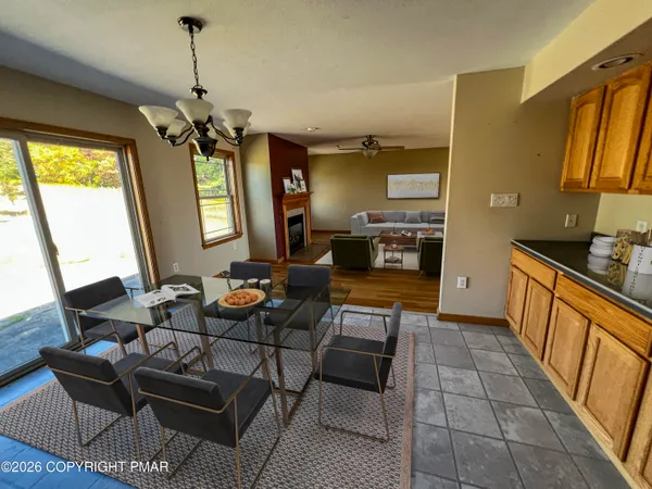 a kitchen with a stove kitchen island and a refrigerator