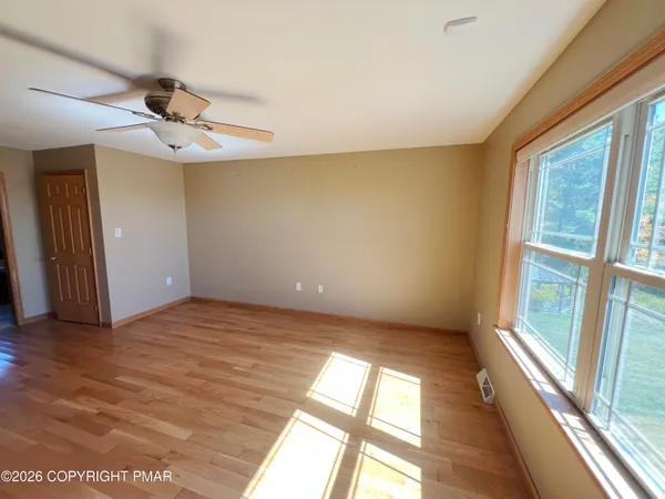 a view of an empty room with a window