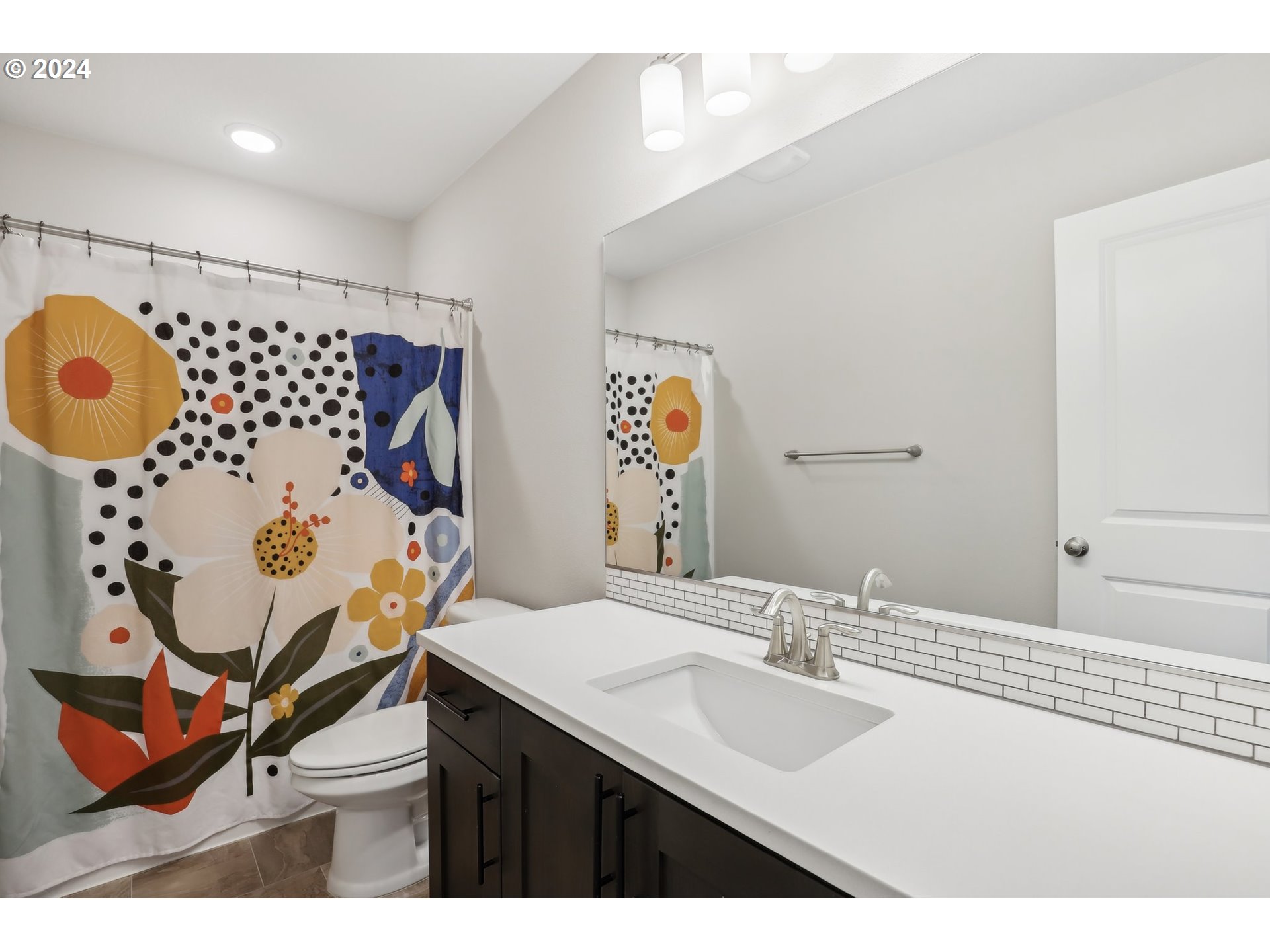1817 Northeast 171st Street Ridgefield, WA 98642 - Photo 21 of 32 a bathroom with a sink mirror and vanity