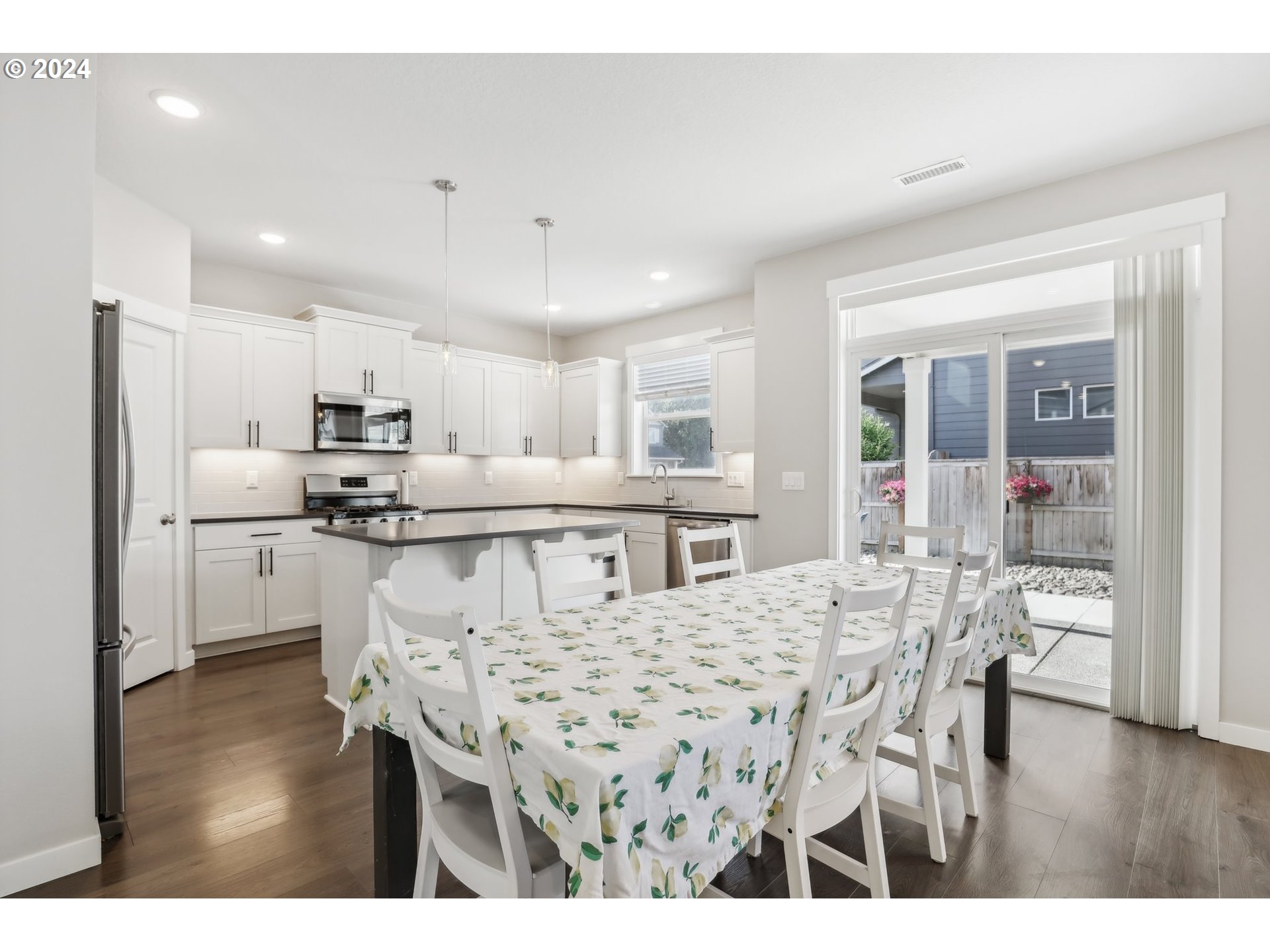 1817 Northeast 171st Street Ridgefield, WA 98642 - Photo 6 of 32 a kitchen with a table and chairs in it
