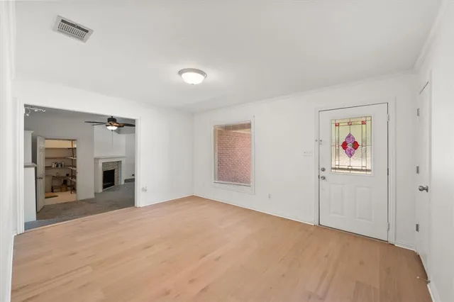 a view of a big room with closet and chandelier fan