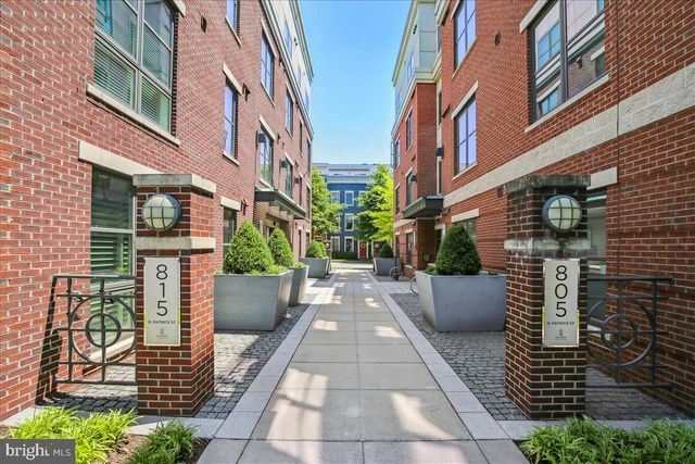 a view of a livingroom with furniture and hardwood floor