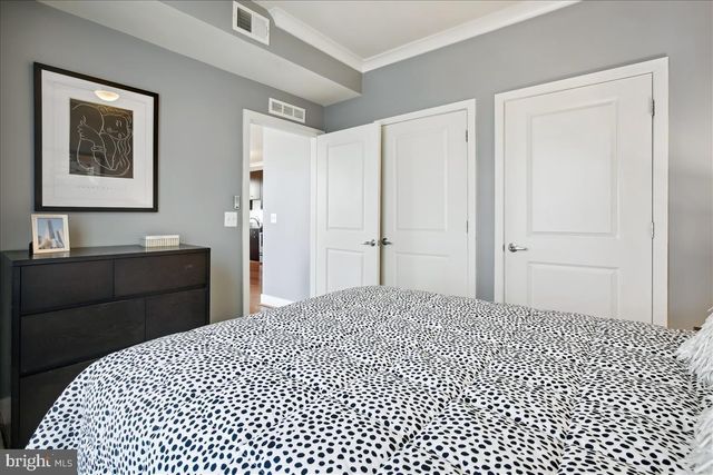 a bathroom with a granite countertop toilet a sink and a mirror