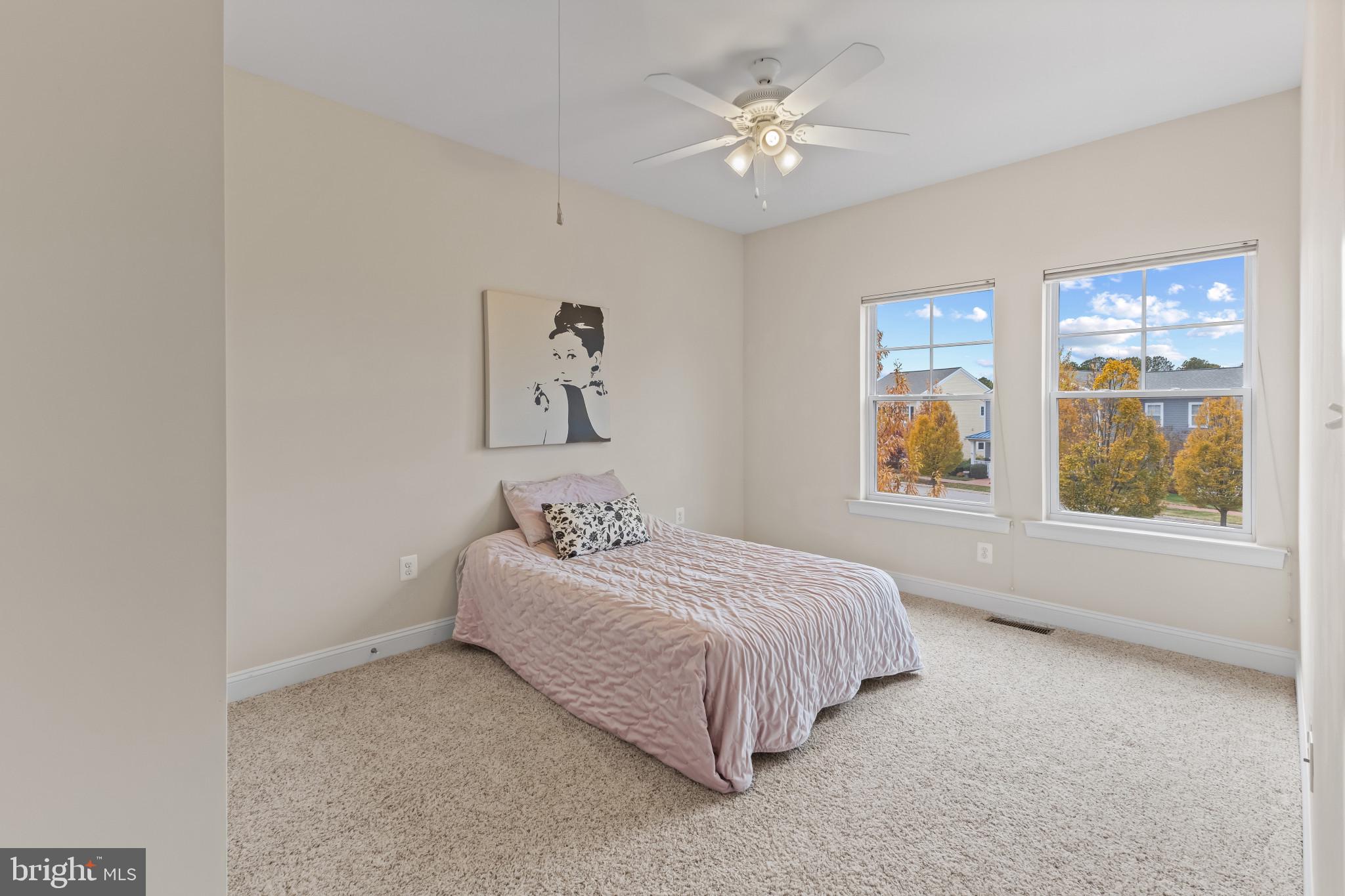 132 Claiborne Street Chester, MD 21619 - Photo 18 of 40 a bedroom with a bed and a window