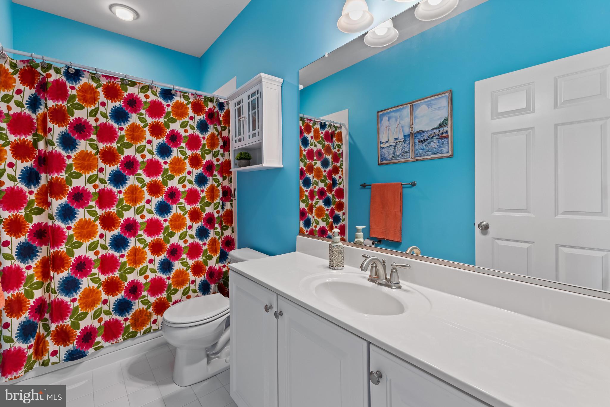 132 Claiborne Street Chester, MD 21619 - Photo 20 of 40 a bathroom with a sink mirror vanity and toilet