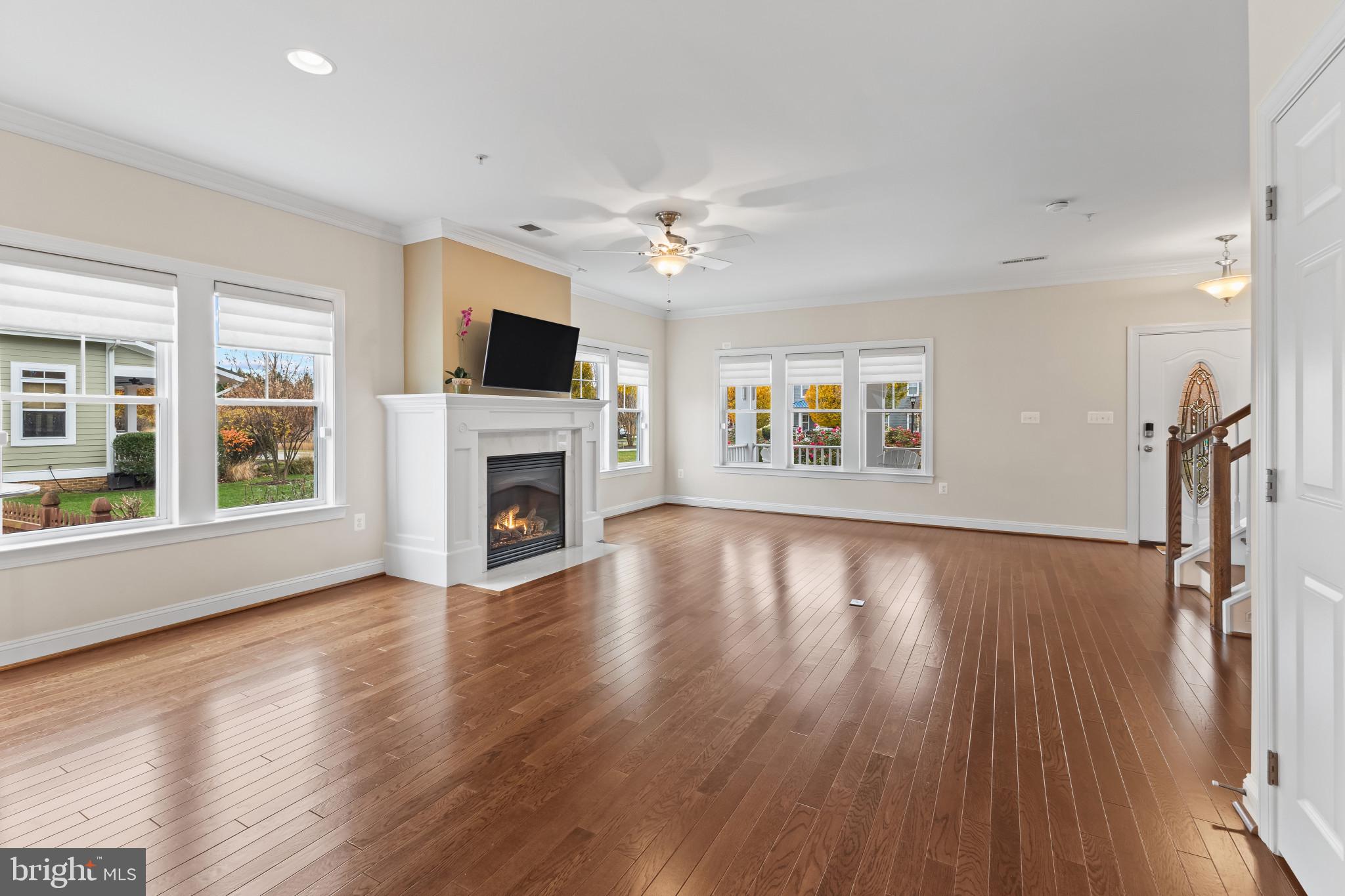 132 Claiborne Street Chester, MD 21619 - Photo 5 of 40 a view of a livingroom with wooden floor fireplace and a window