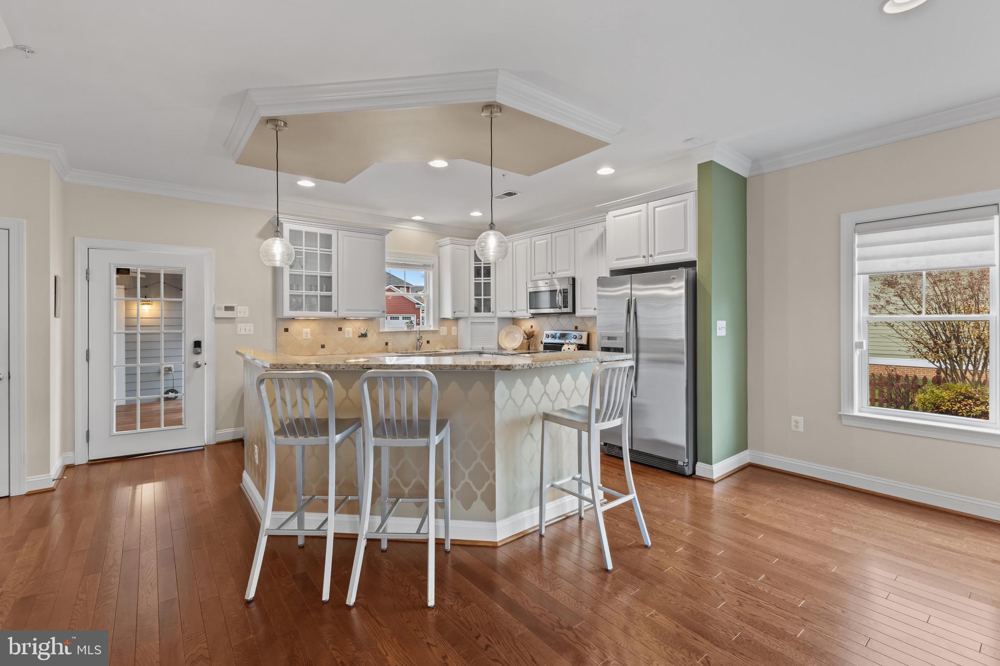132 Claiborne Street Chester, MD 21619 - Photo 8 of 40 a view of a dining room with furniture and wooden floor