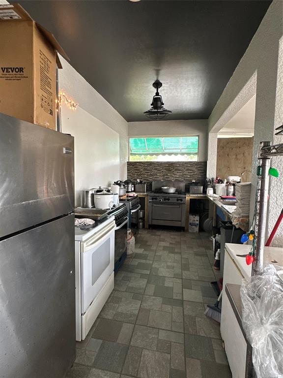 3401 Sand Road Cape Coral, FL 33993 - Photo 11 of 27 a kitchen with lots of counter top space