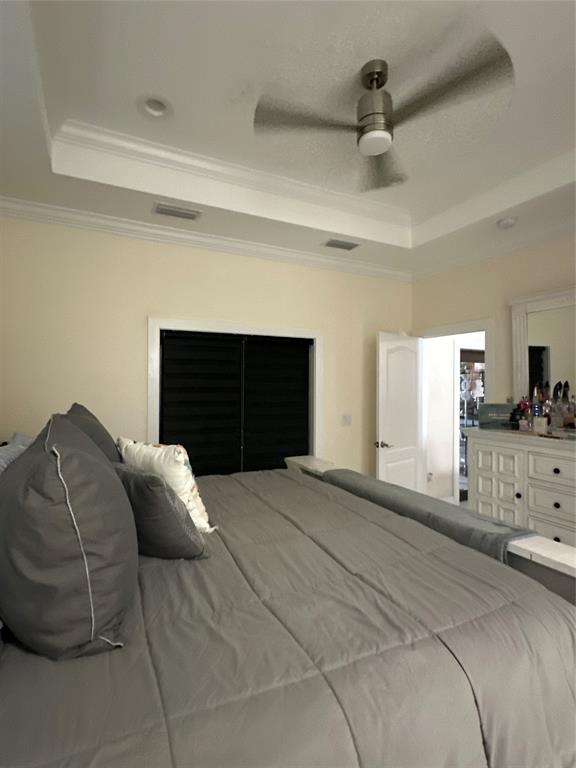 3401 Sand Road Cape Coral, FL 33993 - Photo 13 of 27 a bedroom with a bed and a fireplace