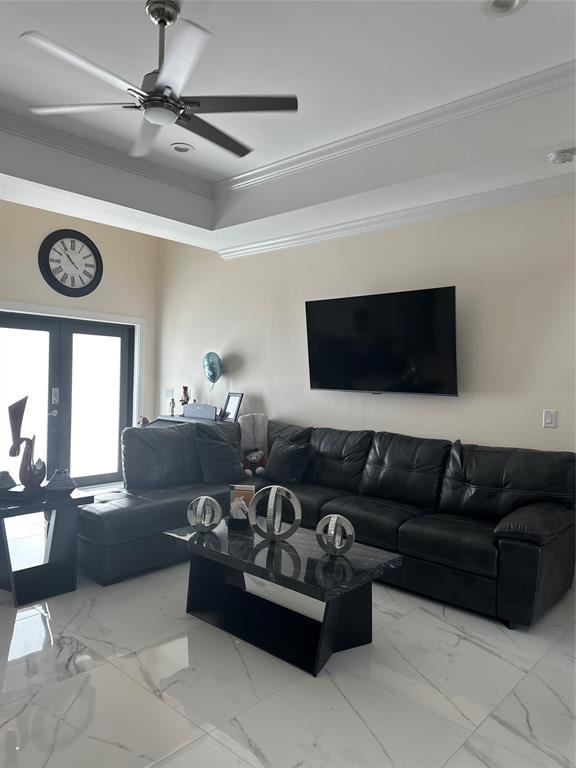 3401 Sand Road Cape Coral, FL 33993 - Photo 19 of 27 a living room with furniture and a flat screen tv