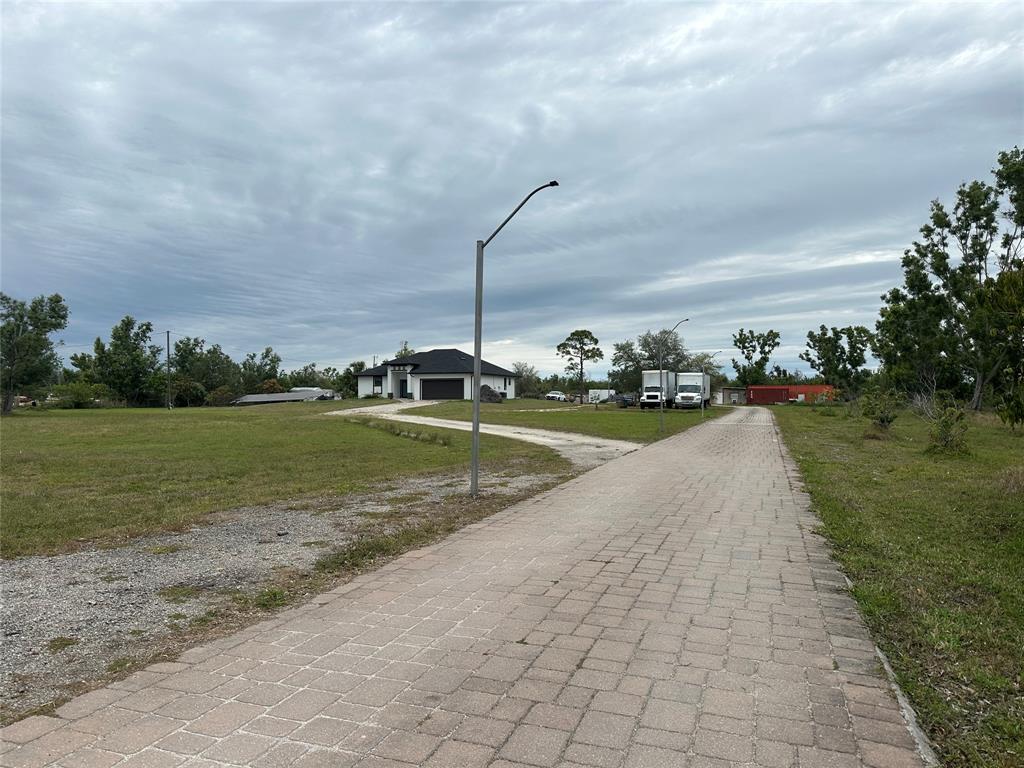 3401 Sand Road Cape Coral, FL 33993 - Photo 2 of 27 a view of a road with an ocean view