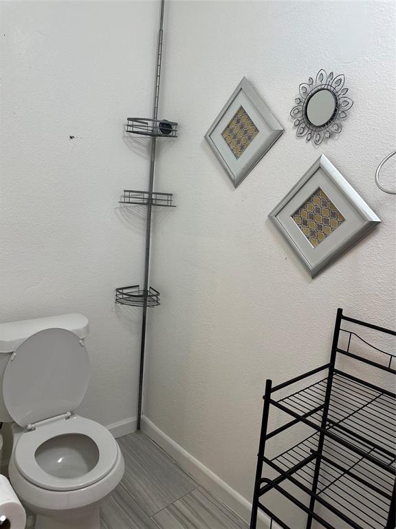 3401 Sand Road Cape Coral, FL 33993 - Photo 26 of 27 a bathroom with a toilet and a shower