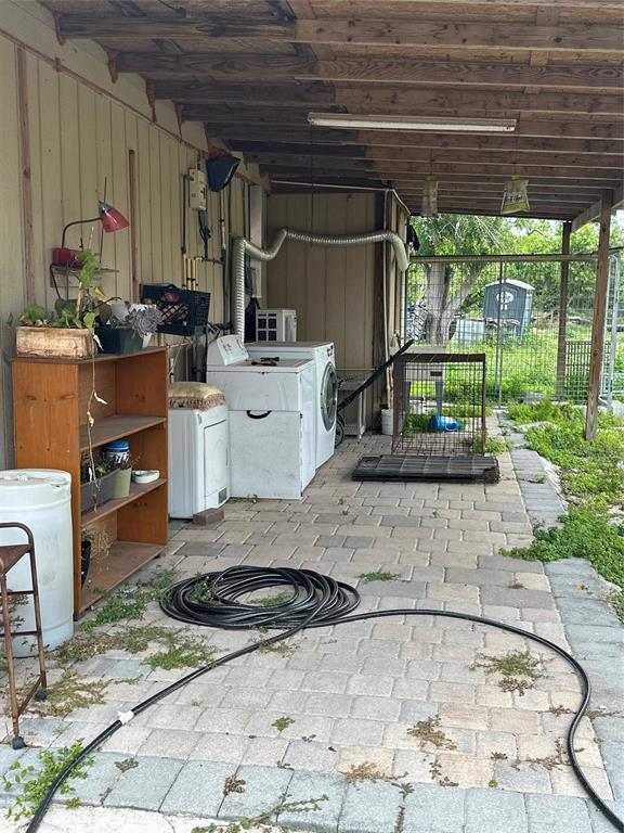3401 Sand Road Cape Coral, FL 33993 - Photo 5 of 27 a kitchen with a stove a refrigerator and sink