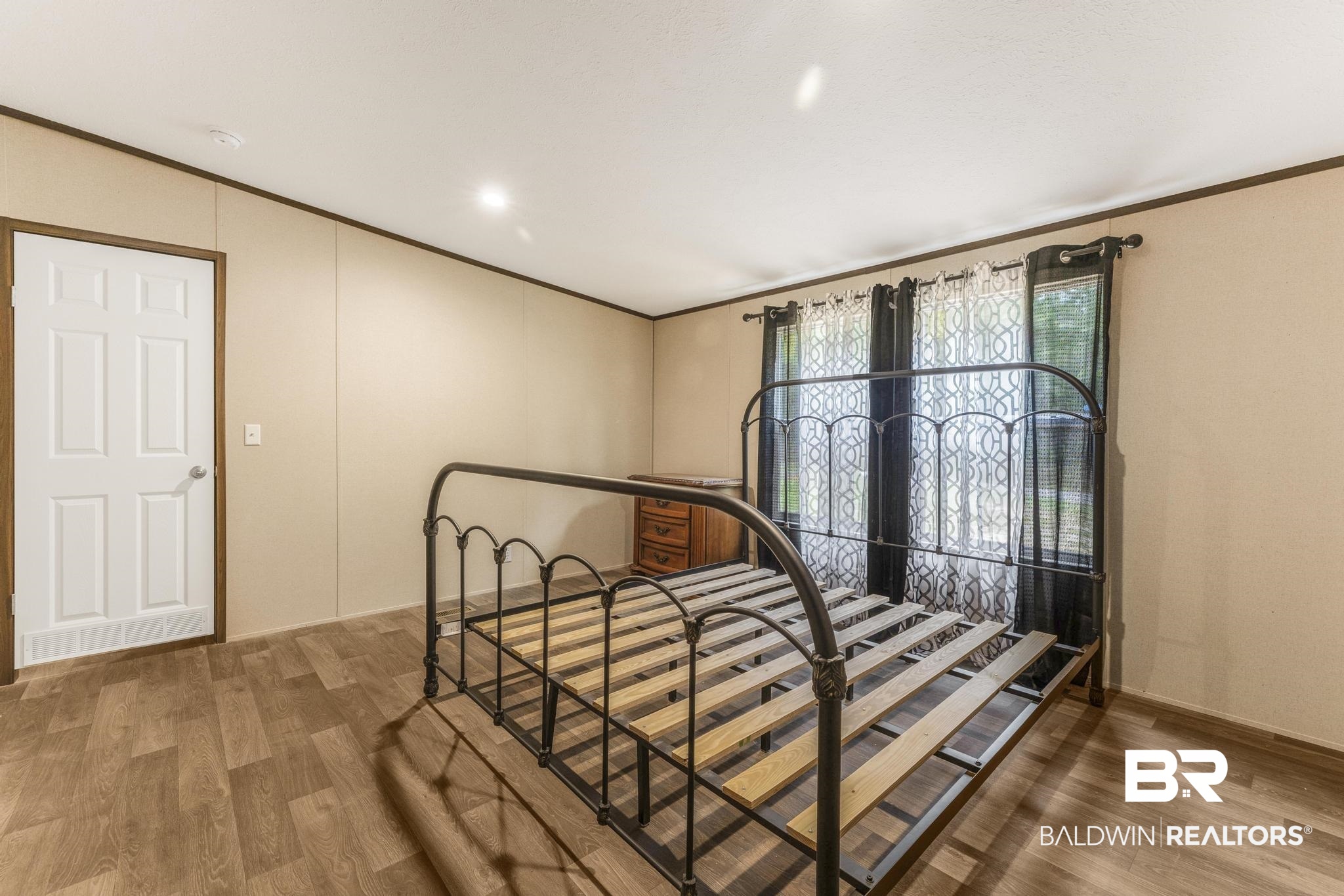 54309 Klasnich Road Perdido, AL 36562 - Photo 20 of 29 Bedroom featuring ornamental molding and wood finished floors