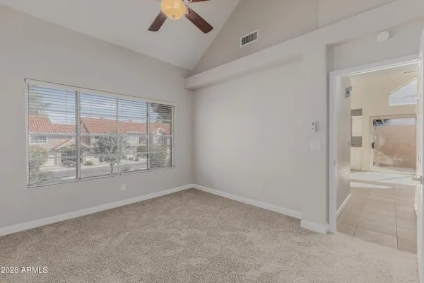 a bathroom with a toilet a sink a vanity and mirror