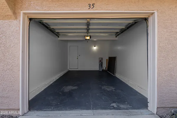 a view of outdoor space with a garden and trees