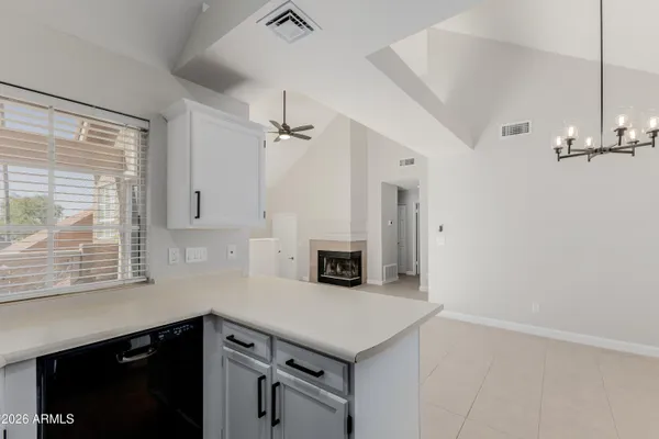 a kitchen with a refrigerator and a sink