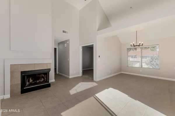 a living room with a fireplace and a fireplace