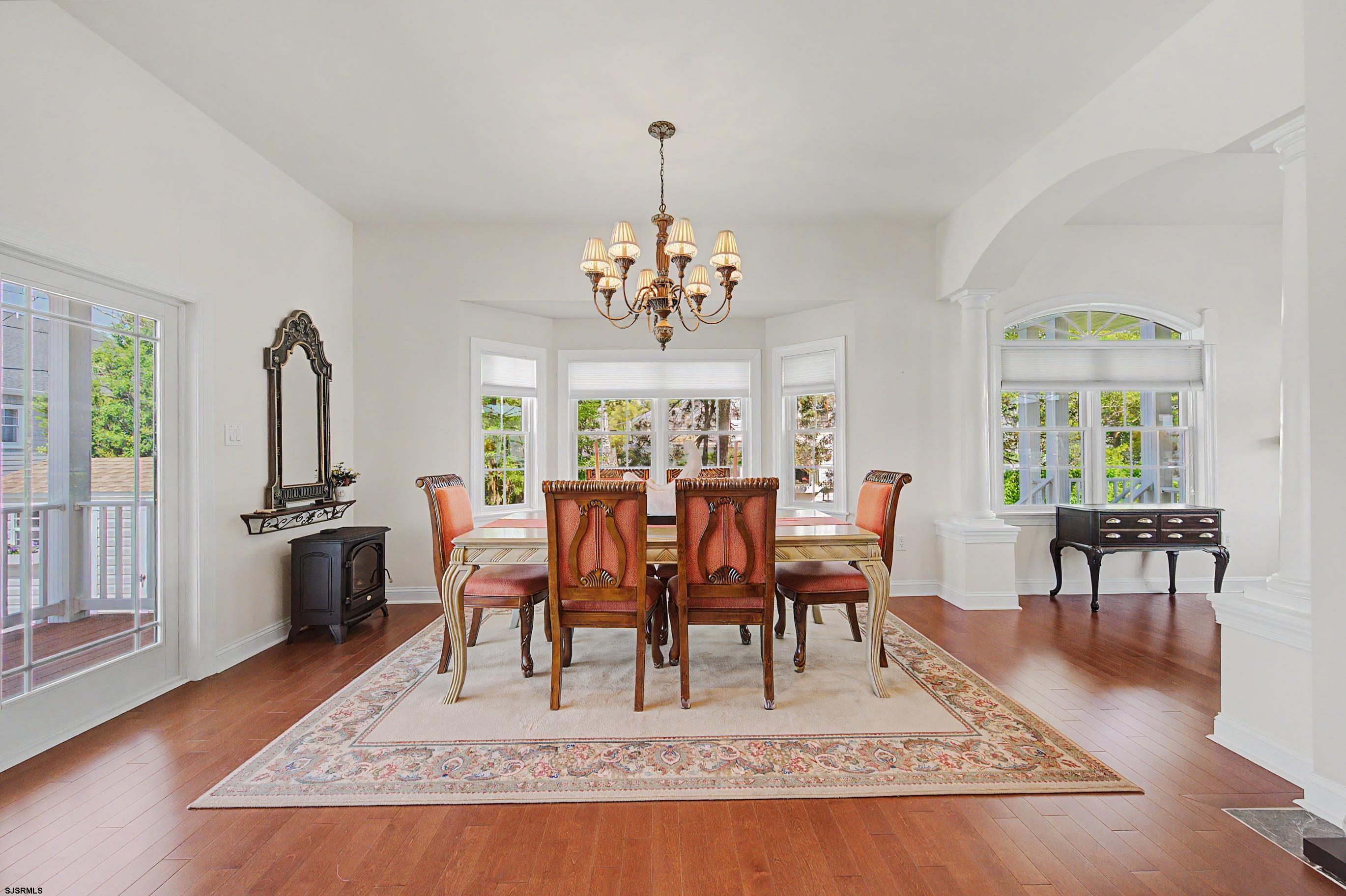 212 17th Street South Brigantine, NJ 08203 - Photo 12 of 37 a view of a dining room with furniture window and wooden floor