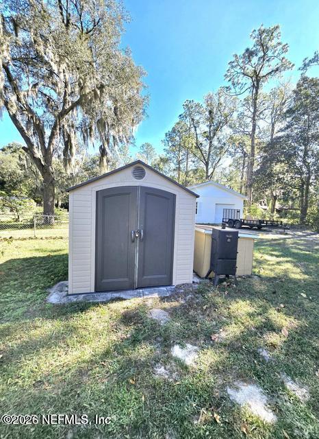 6107 Carlton Road Jacksonville, FL 32244 - Photo 13 of 39 a view of backyard with large tree