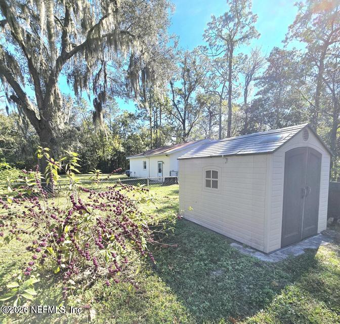 6107 Carlton Road Jacksonville, FL 32244 - Photo 14 of 39 a view of a house with a yard