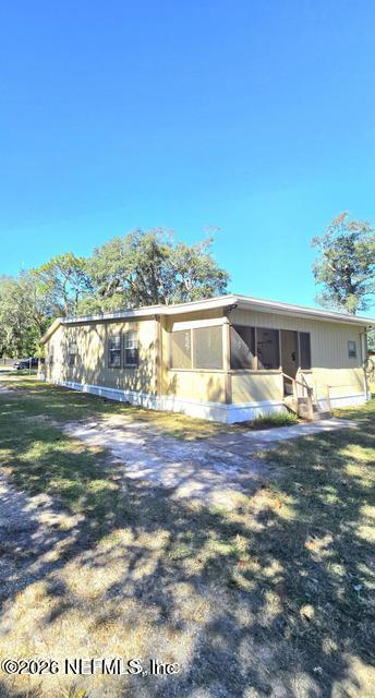 6107 Carlton Road Jacksonville, FL 32244 - Photo 20 of 39 a front view of house with yard and lake view in back