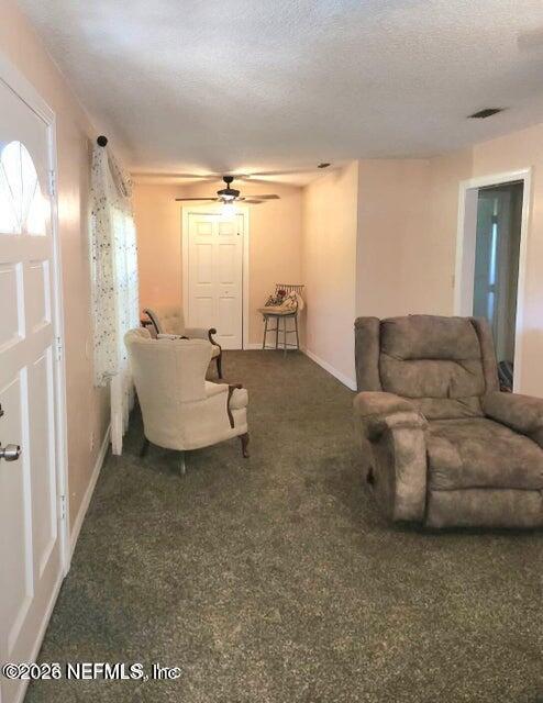 6107 Carlton Road Jacksonville, FL 32244 - Photo 21 of 39 a living room with furniture and a large window