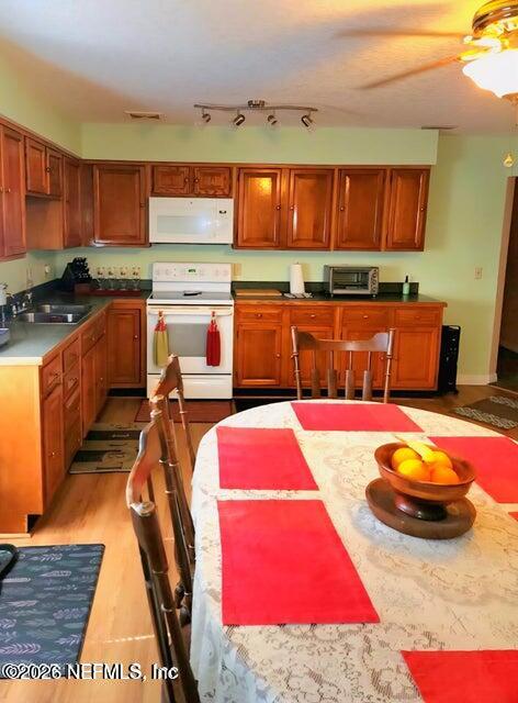 6107 Carlton Road Jacksonville, FL 32244 - Photo 25 of 39 a kitchen with stainless steel appliances kitchen island granite countertop a stove and cabinets