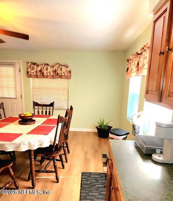 6107 Carlton Road Jacksonville, FL 32244 - Photo 26 of 39 a dining room with furniture and window
