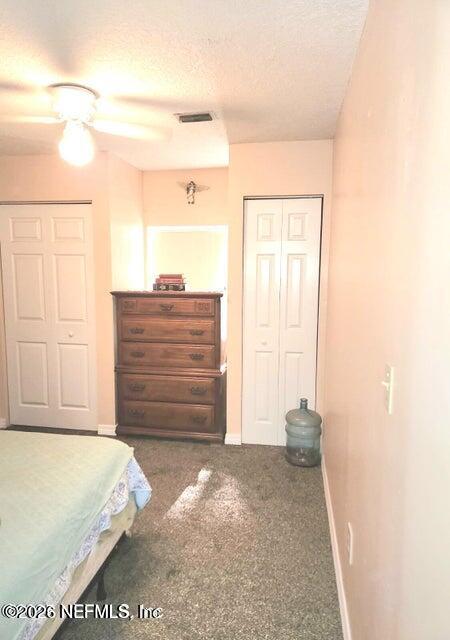 6107 Carlton Road Jacksonville, FL 32244 - Photo 30 of 39 a view of walk in closet with clothes