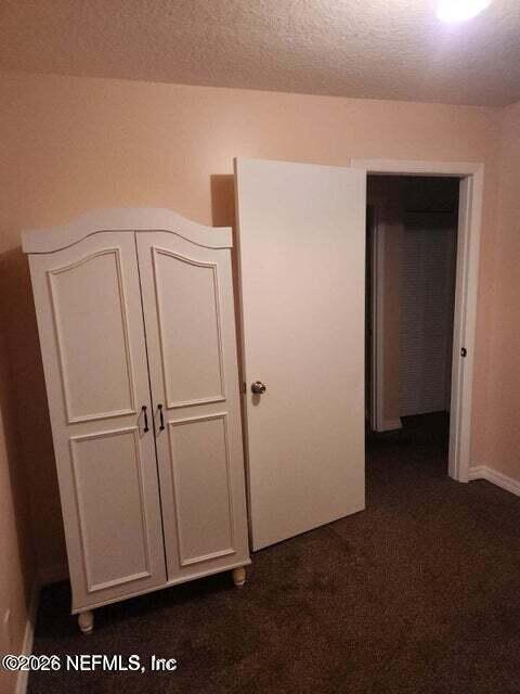6107 Carlton Road Jacksonville, FL 32244 - Photo 32 of 39 a view of a kitchen with white wooden cabinets