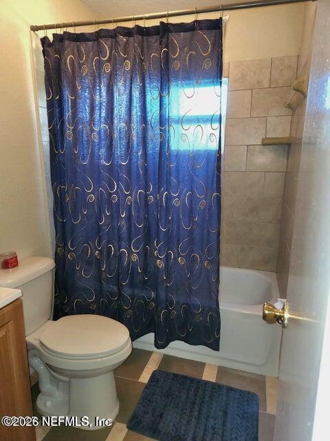 6107 Carlton Road Jacksonville, FL 32244 - Photo 33 of 39 a bathroom with a toilet and a shower