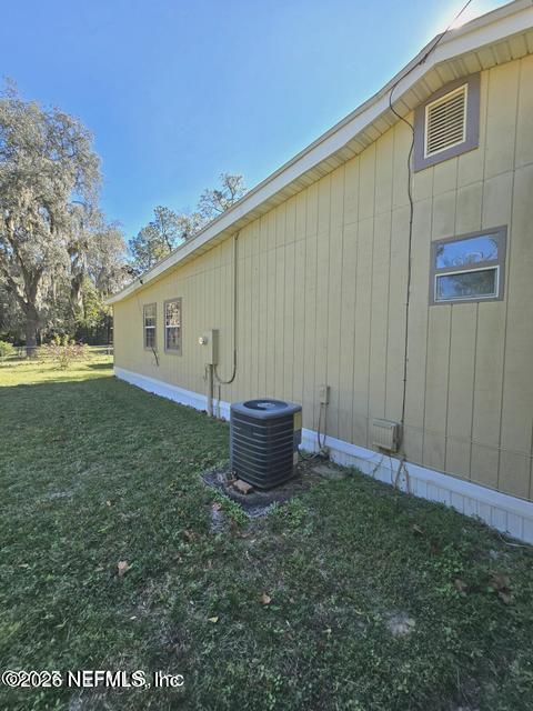 6107 Carlton Road Jacksonville, FL 32244 - Photo 4 of 39 a backyard of a house with wooden fence