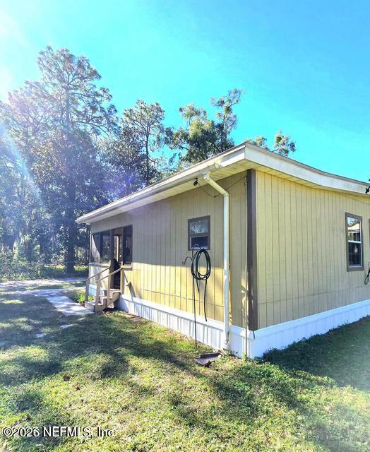 6107 Carlton Road Jacksonville, FL 32244 - Photo 7 of 39 a view of a house with backyard and sitting area