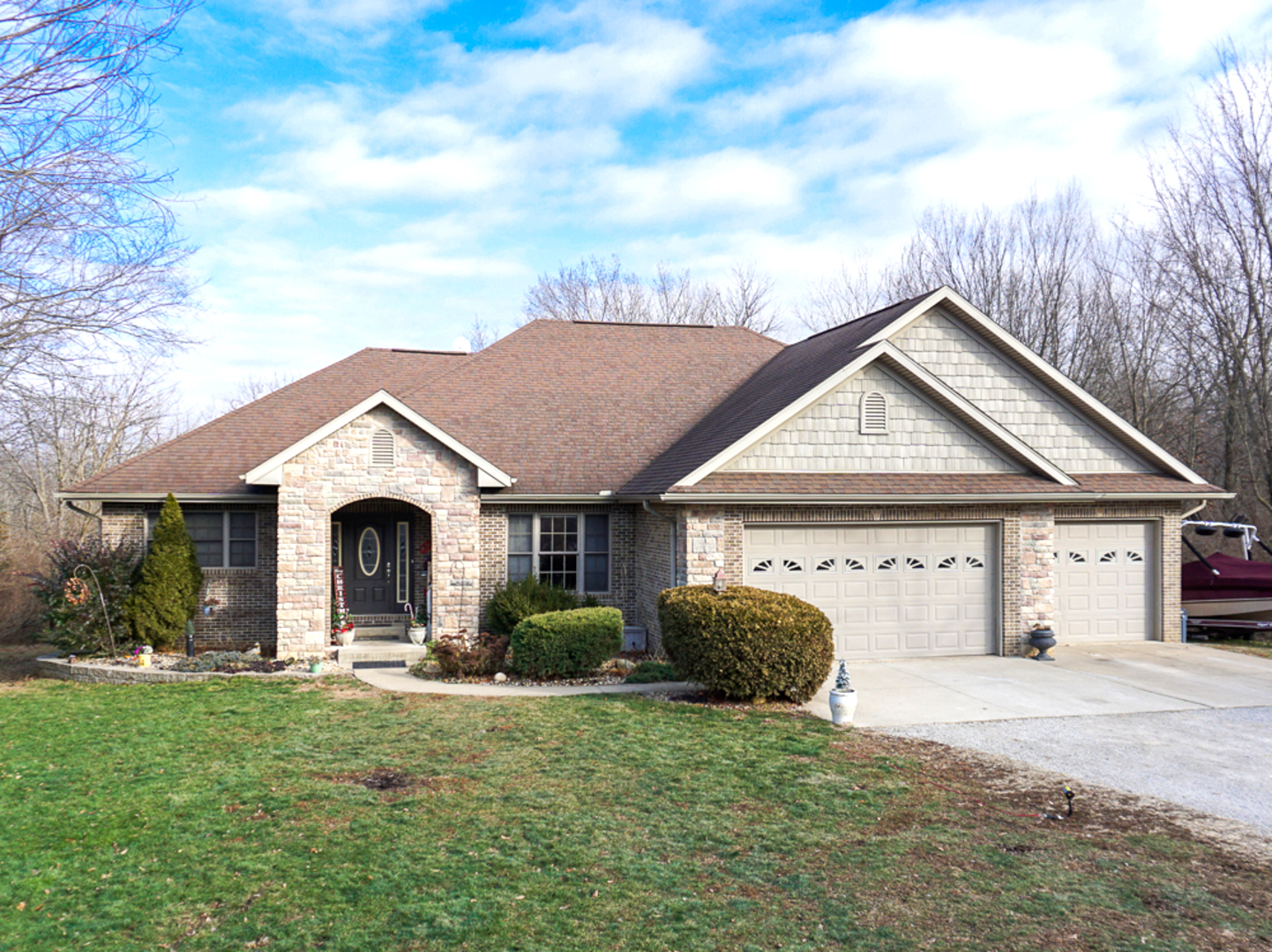 938 Kickapoo Drive Danvers, IL 61732 - Photo 1 of 49 a front view of a house with garden