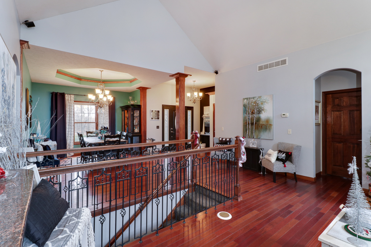 938 Kickapoo Drive Danvers, IL 61732 - Photo 11 of 49 a living room with furniture a wooden floor and a large window
