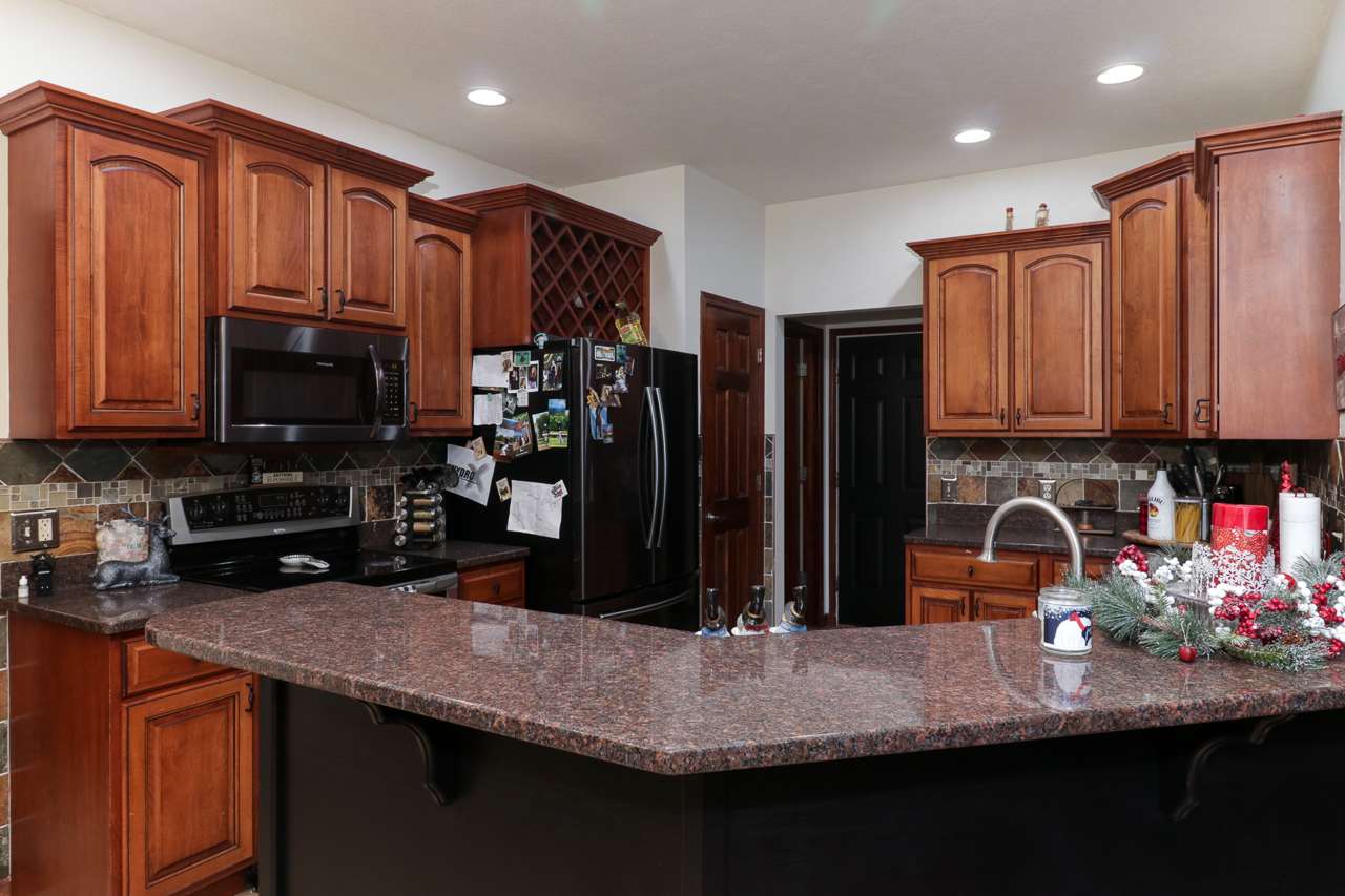 938 Kickapoo Drive Danvers, IL 61732 - Photo 15 of 49 a kitchen with sink and refrigerator