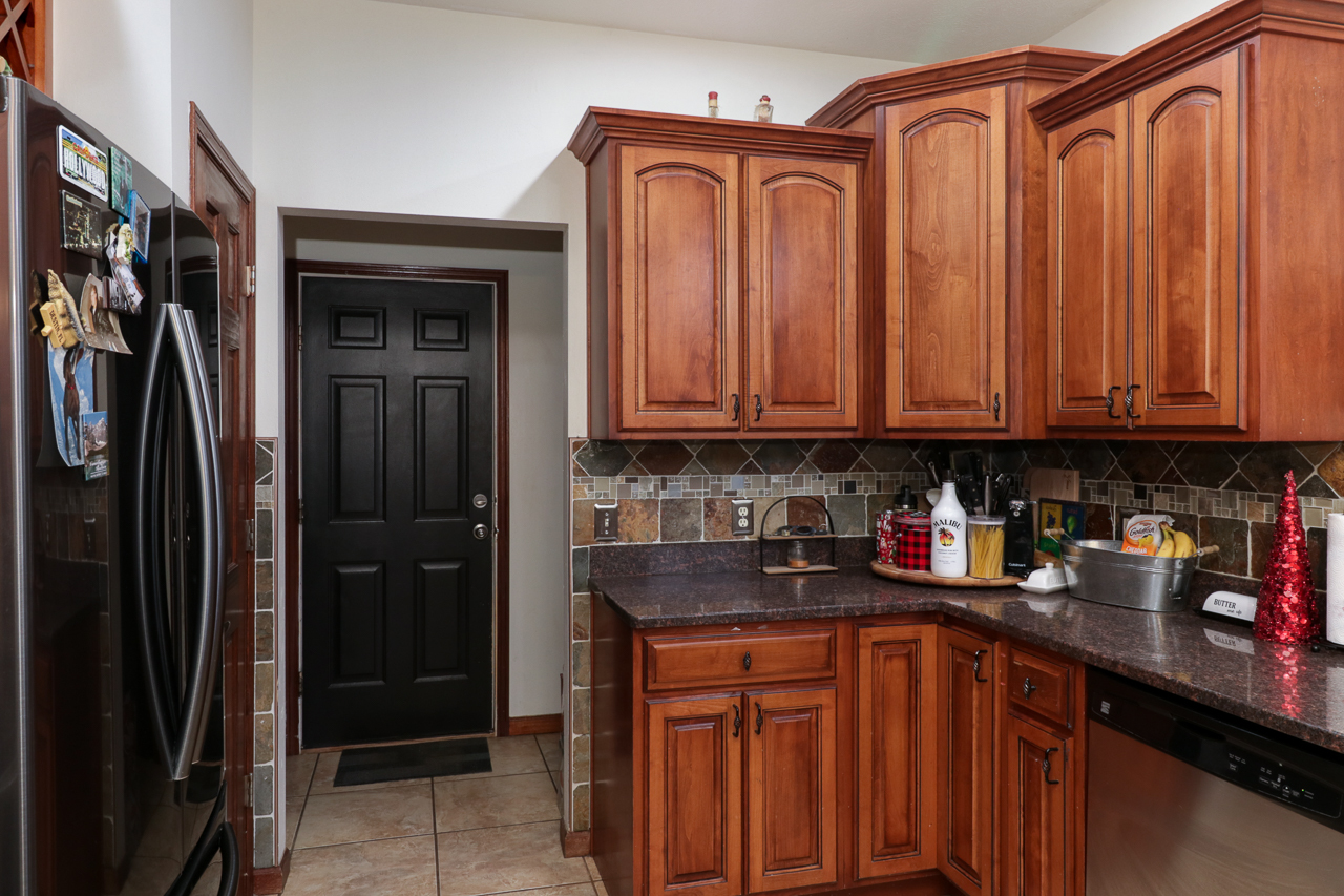938 Kickapoo Drive Danvers, IL 61732 - Photo 17 of 49 a kitchen with stainless steel appliances granite countertop a refrigerator and a sink