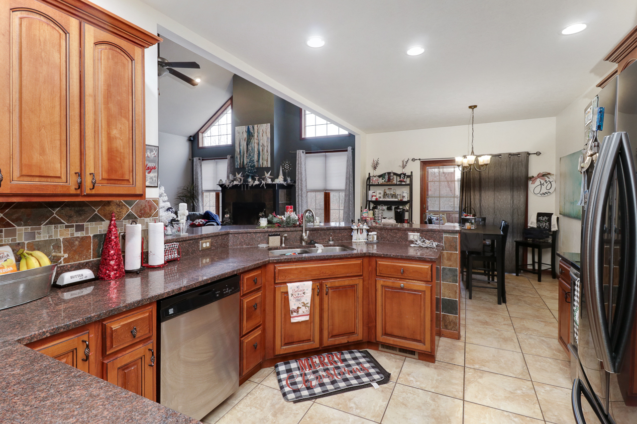 938 Kickapoo Drive Danvers, IL 61732 - Photo 18 of 49 a kitchen with stainless steel appliances granite countertop a sink a stove and cabinets