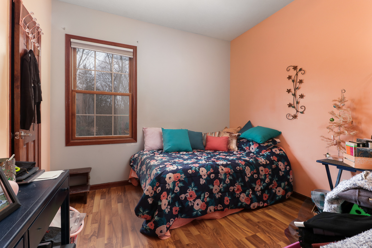 938 Kickapoo Drive Danvers, IL 61732 - Photo 21 of 49 a bedroom with a bed and a window