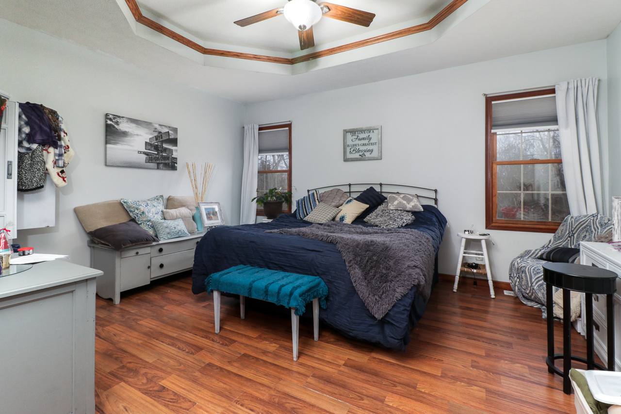 938 Kickapoo Drive Danvers, IL 61732 - Photo 22 of 49 a bedroom with a bed and wooden floor