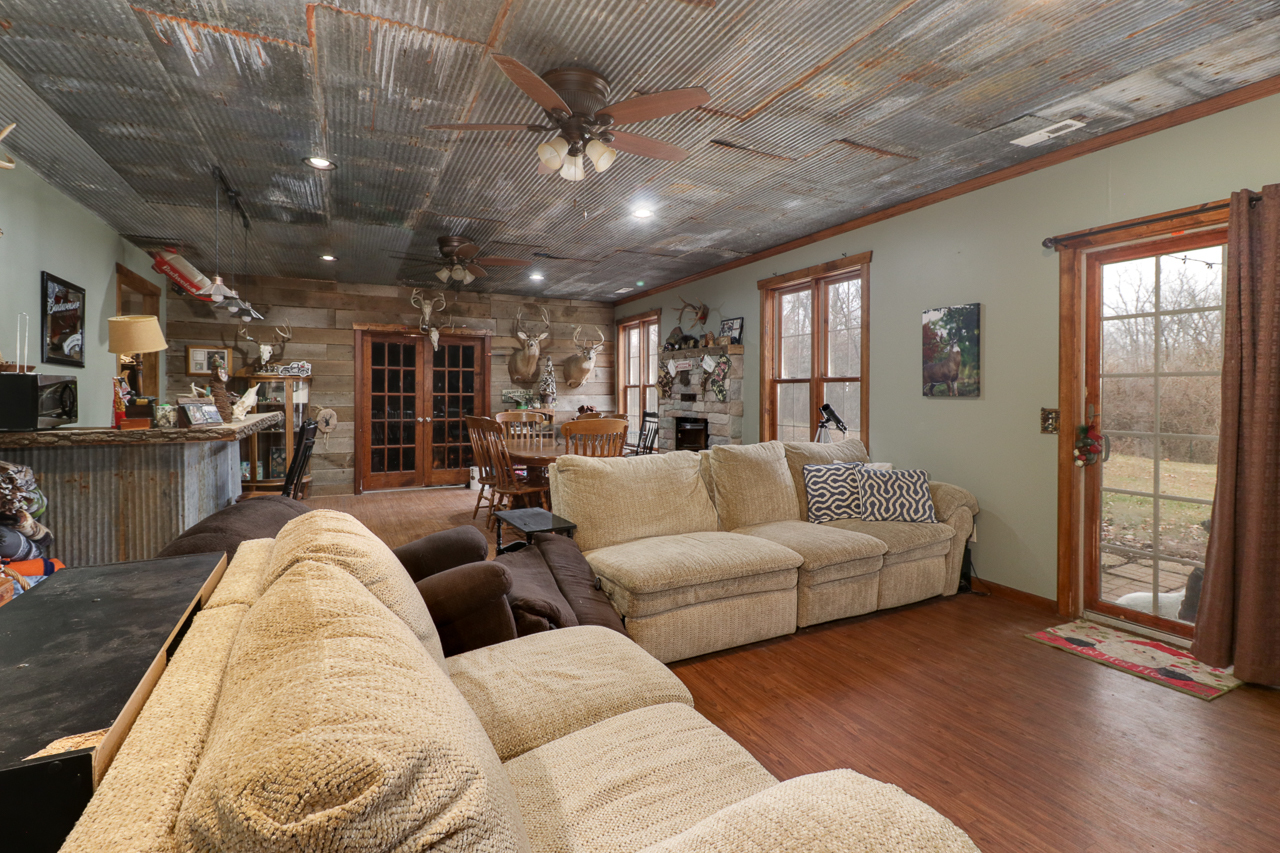 938 Kickapoo Drive Danvers, IL 61732 - Photo 27 of 49 a living room with furniture and a large window