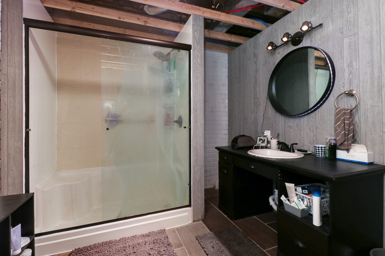 938 Kickapoo Drive Danvers, IL 61732 - Photo 31 of 49 a bathroom with a sink and a mirror