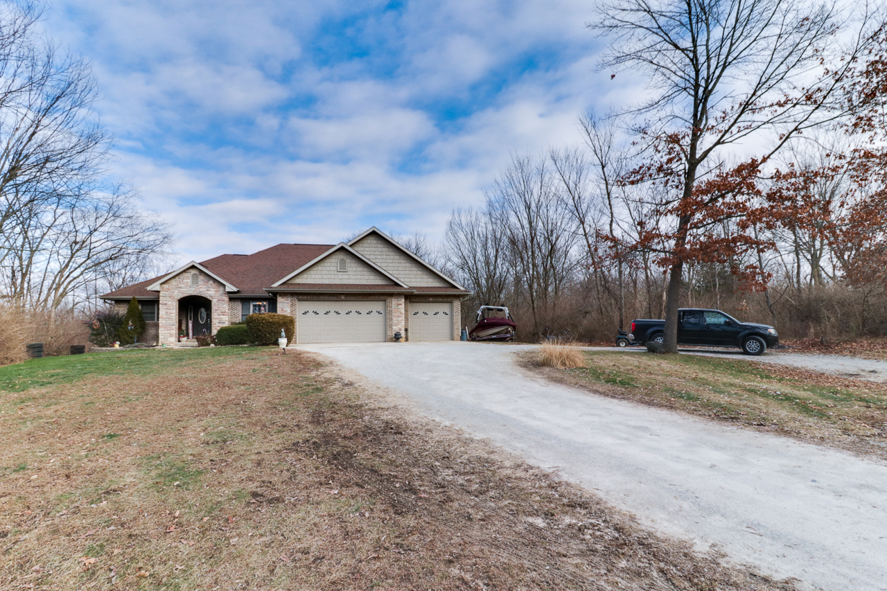 938 Kickapoo Drive Danvers, IL 61732 - Photo 35 of 49 a view of house with trees in front of it
