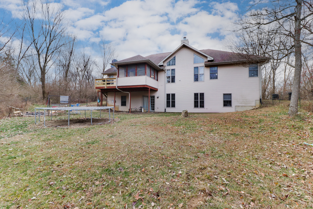 938 Kickapoo Drive Danvers, IL 61732 - Photo 36 of 49 a view of a house with a yard and large tree